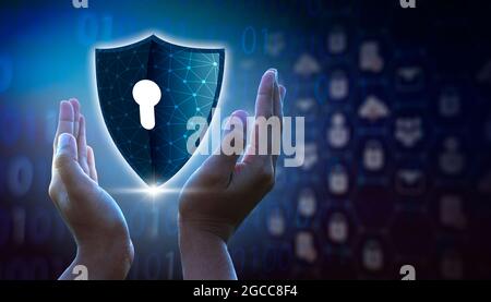 Highly secure IT device protection shield. blue background Stock Photo