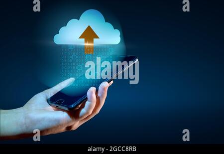 Digital data set of binary numbers being sent to the clouds on a blue background. Stock Photo