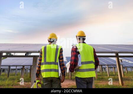 engineer working on checking equipment in solar power plant Stock Photo