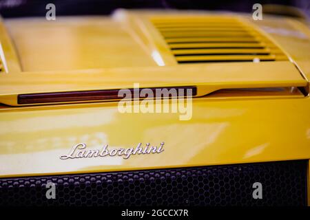 Bucharest, Romania - August 7, 2021: Shallow depth of field (selective focus) details of a yellow convertible Lamborghini sports car. Stock Photo