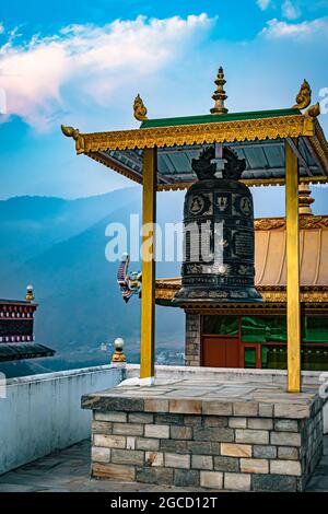 A closeup of Tibetan bells and an old spiritual book Stock Photo - Alamy