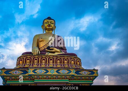 huge buddha golden statue from different perspective with moody sky at evening image is taken at giant buddha statue tawang arunachal pradesh india. Stock Photo
