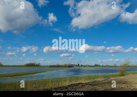 Archive image for wallpaper or background: blue sky and clouds over the Fens in Cambridgeshire Stock Photo