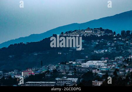 tawang monastery view from mountain top at dawn from flat angle image is taken at tawang arunachal pradesh india. Stock Photo