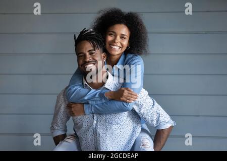 Portrait of happy ethnic couple hugging embracing Stock Photo