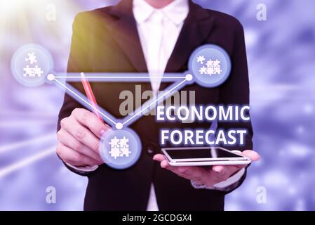 Conceptual caption Economic Forecast. Word Written on attempting to predict the future condition of the economy Lady In Uniform Holding Tablet In Hand Stock Photo
