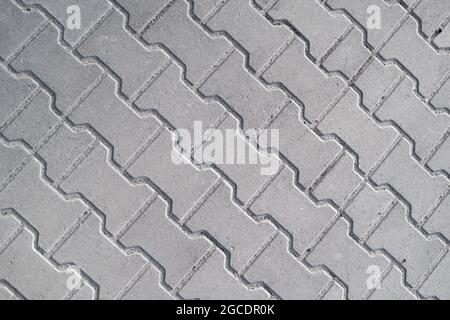 Brick pavement tile, top view. Urban texture as background. Stock Photo