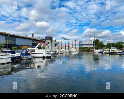 Oberhausen (Centro), Germany - July 9. 2021: View on inland port with boats in summert, sealife building background Stock Photo