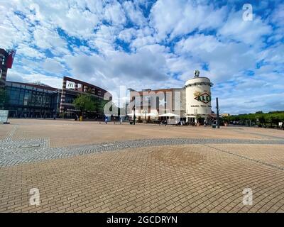 Oberhausen (Centro), Germany - July 9. 2021: View over square on restaurant and shopping mall against blue summer sky Stock Photo