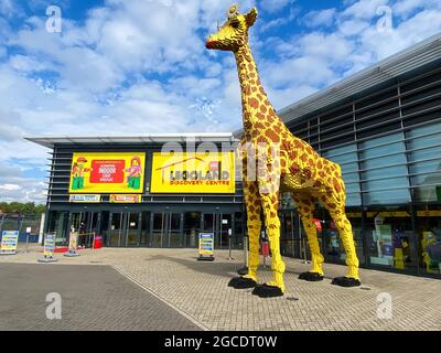 Oberhausen (Centro), Germany - July 9. 2021: View on entrance of Legoland with blue sky in summer with big lego giraffe Stock Photo