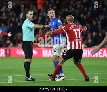Sheffield, England, 7th August 2021. David McGoldrick of Sheffield Utd argues for a penalty to referee Tim Robinson following a tackle on Sander Berge by Tahiti Chong  during the Sky Bet Championship match at Bramall Lane, Sheffield. Picture credit should read: Simon Bellis / Sportimage Stock Photo