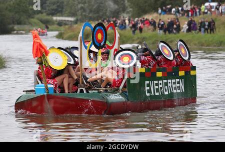 Lewes, UK. 08th Aug, 2021. Adventurous seafarers navigate along the River Ouse from Lewes to Newhaven in there self-propelled rafts on a seven-mile charity voyage. This years race theme is the Tokyo Olympics, so competitors have to be Olympic themed or be celebrating Japanese culture. A prize will be given to the fastest raft on the day. There will also be awards for the best decorated raft, the most environmentally friendly raft and the Constructors cup. Credit: James Boardman/Alamy Live News Stock Photo