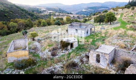 Ruins of stone buildings in abandoned Trozena village in Paphos area, Cyprus Stock Photo