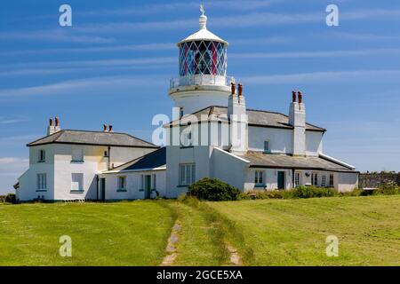 The old lighthouse building (built 1829) on the clifftops at Caldey Island off the coast of Wales, UK Stock Photo