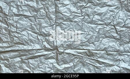 Crumpled Plastic Bag Texture, Gray Creased Plastic Sheet, Abstract Shapes for Background. Stock Photo