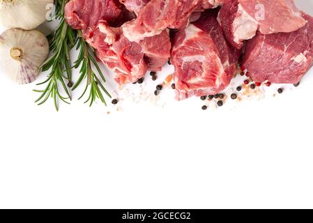 Fresh juicy pork chop with herbs and rosemary isolated on white, close up. Stock Photo