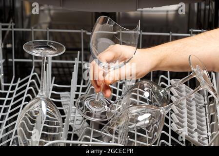 Broken wine glass in dishwasher after washing. Stock Photo