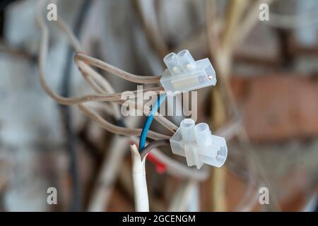 Plastic connection of electrical cables at home, close up Stock Photo