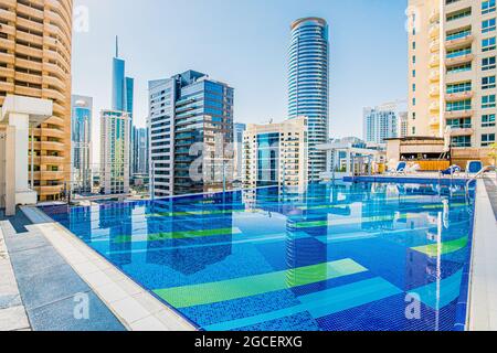 Rooftop swimming pool without people with views of numerous huge skyscrapers. The concept of amazing places for sightseeing and relaxation Stock Photo