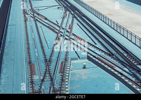 Tangled intersection of railway tracks and rails of a train or city rapid tram or metro, aerial view. Transportation and logistics concept Stock Photo