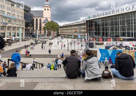 Town square in front of railway station in Cologne is a famous place to hang around on weekend days. Stock Photo