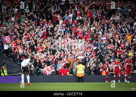 LONDON, UK. AUG 8TH Middlesbrough fans celebrate their equaliser during the Sky Bet Championship match between Fulham and Middlesbrough at Craven Cottage, London on Sunday 8th August 2021. (Credit: Tom West | MI News) Credit: MI News & Sport /Alamy Live News Stock Photo