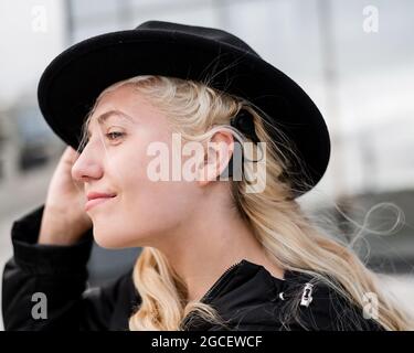 Portrait of a blonde woman wearing a Hearing Aid Stock Photo