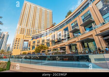 23 February 2021, Dubai, UAE: Marina Mall and hotel with cafe and restaurants near Stock Photo