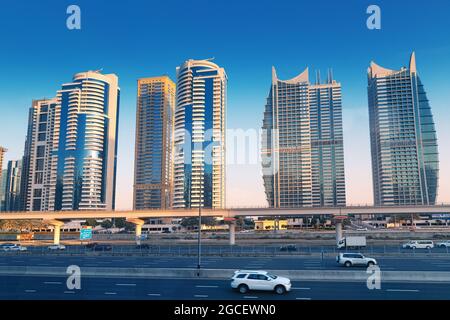 23 February 2021, Dubai, UAE: view of the famous Sheikh Zayed Road with car traffic and numerous skyscrapers hotels in Dubai Marina area Stock Photo
