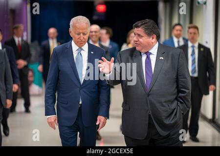 President Joe Biden talks with Illinois Governor J.B. Pritzker, Wednesday, July 7, 2021, at McHenry County College in Crystal Lake, Illinois. (Official White House Photo by Adam Schultz) Stock Photo