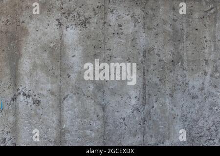 Reinforced concrete texture. Surface of old and dirty reinforced concrete with traces of wooden formwork. Stock Photo