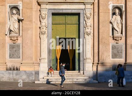 Façade of the Church of Jesus (Chiesa del Gesù, 16th century) in the historic centre of Genoa with people in a sunny day, Liguria, Italy Stock Photo