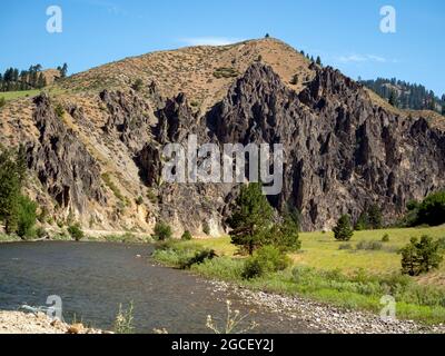 ID00825-00...IDAHO - Impressive cliffs rising above the Middle Fork Boise River viewed from the Middle Fork Road. Stock Photo