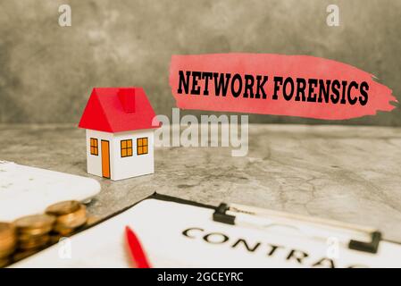 Writing displaying text Network Forensics. Word Written on monitoring and analysis of computer network traffic Saving Money For A Brand New House Stock Photo