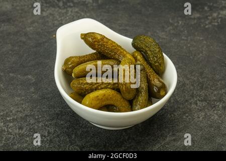 Pickled young gherkin in the bowl Stock Photo