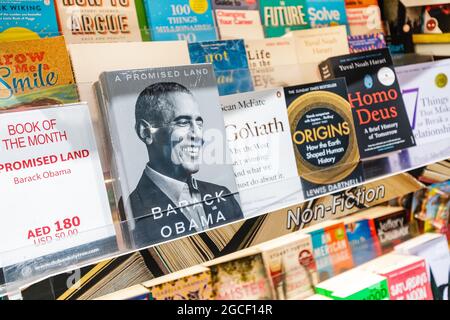 26 February 2021, Dubai, UAE: Barack Obama book Promised Land on the shelf in the store among other bestsellers