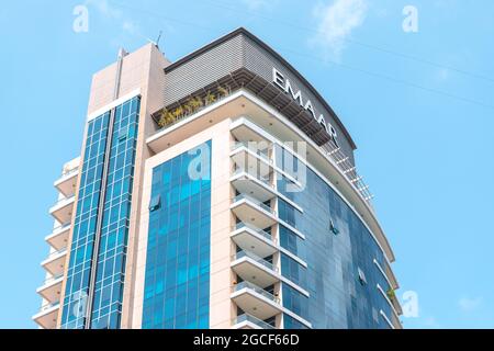 26 February 2021, UAE, Dubai: Emaar developer logo on a roof of a high skyscraper tower in Dubai Marina Stock Photo