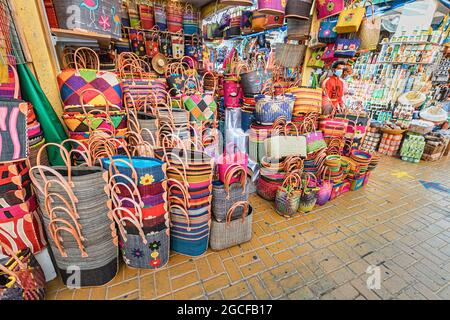 26 February 2021, UAE, Dubai: large pile of various wicker hand made baskets for sale on the African market in Global Village. Traditional craftsmansh Stock Photo