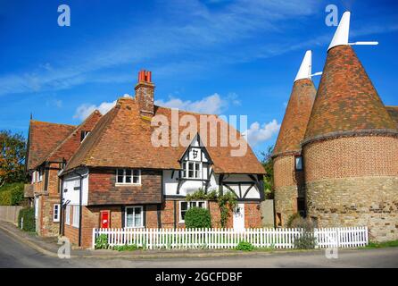 Oast Houses by cottage, Heaverham, Kent, England, United Kingdom Stock Photo