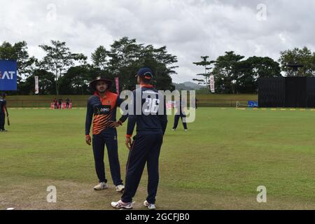 Sri Lankan cricketers Dinesh Chandimal and Angelo Perera having a chat. The picturesque Army Ordinance cricket grounds. Dombagoda. Sri Lanka.