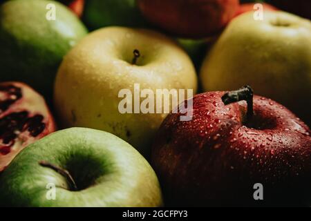 A closeup shot of freshly washed apples of different kinds and colors Stock Photo