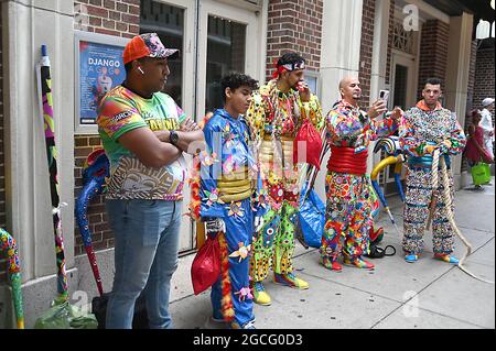 People dressed as Diablos Cojuelos attend the Dominican Day Parade on August 8, 2021 on the Avenue of the Americas in New York, New York. Robin Platzer/ Twin Images/ Credit: Sipa USA/Alamy Live News Stock Photo