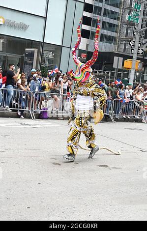 People dressed as Diablos Cojuelos attend the Dominican Day Parade on August 8, 2021 on the Avenue of the Americas in New York, New York. Robin Platzer/ Twin Images/ Credit: Sipa USA/Alamy Live News Stock Photo