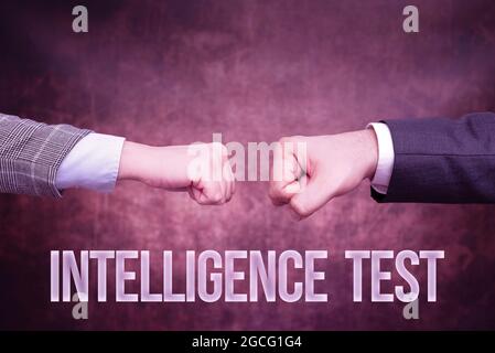 Sign displaying Intelligence Test. Word Written on test designed to measure the ability to think and reason Two Professional Well-Dressed Corporate Stock Photo