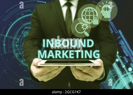 Hand writing sign Inbound Marketing. Word Written on a strategy that focuses on attracting customers or leads Man In Office Uniform Holding Tablet Stock Photo