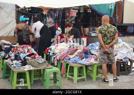 Beirut, Lebanon. 08th Aug, 2021. Rugs on sale at Souq el Ahad (Sunday Market), Beirut, Lebanon, on August 8, 2021. Prices hike have become a hard issue for Lebanon, as more than half of the population has fallen under the poverty line since the economic and financial crisis started in 2019. Middle class has been wiped away and less and less people can afford to purchase things as shoes and garments in the shops. (Photo by Elisa Gestri/Sipa USA) Credit: Sipa USA/Alamy Live News Stock Photo