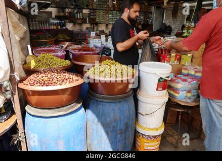 Beirut, Lebanon. 08th Aug, 2021. A grocery vendor at Souq el Ahad (Sunday Market), Beirut, Lebanon, on August 8, 2021. Food prices hike have become a hard issue for Lebanon, as more than half of the population has fallen under the poverty line since the economic and financial crisis started in 2019. (Photo by Elisa Gestri/Sipa USA) Credit: Sipa USA/Alamy Live News Stock Photo