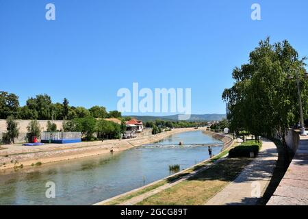 Nis, Serbia - August 08, 2021 Blue river Nisava in downtown of Nis city with promenade and beautiful quay on a sunny summer day Stock Photo