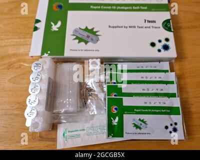 Finally the New Orient Gene Rapid Test available from the NHS  gov.uk/covid19-self-test site only requires people using it to swab both nostrils . No longer is the unpleasant throat swab required . The tests are 99% accurate and look a bit like a pregnancy test a bit like the original Antigen tests but are much better manufactured , the new tests come in green boxes instead of blue the whole kit is better made the cotton swab is slightly bigger and softer material . The results show in just a few minutes ... Stock Photo