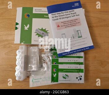 Finally the New Orient Gene Rapid Test available from the NHS  gov.uk/covid19-self-test site only requires people using it to swab both nostrils . No longer is the unpleasant throat swab required . The tests are 99% accurate and look a bit like a pregnancy test a bit like the original Antigen tests but are much better manufactured , the new tests come in green boxes instead of blue the whole kit is better made the cotton swab is slightly bigger and softer material . The results show in just a few minutes ... Stock Photo